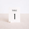 Load image into Gallery viewer, Numéro de table mariage Love Ribbons posé sur table de réception